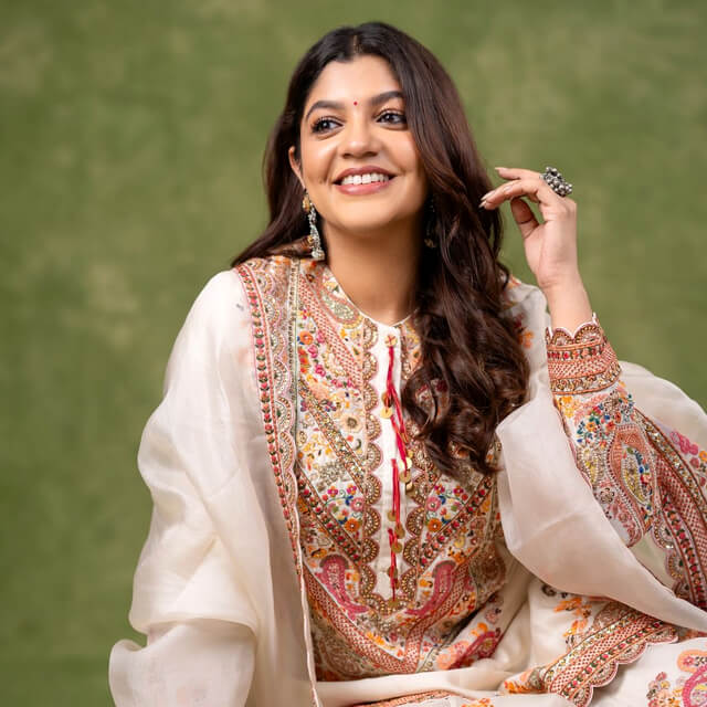 Aparna Balamurali poses elegantly in an Off-white Anarkali Suit