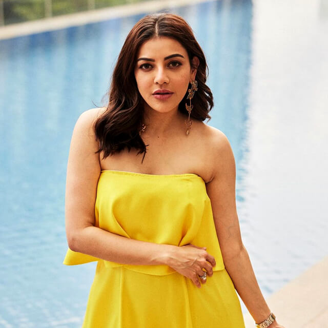 Kajal Aggarwal radiates in a vibrant Yellow Sleeveless Outfit