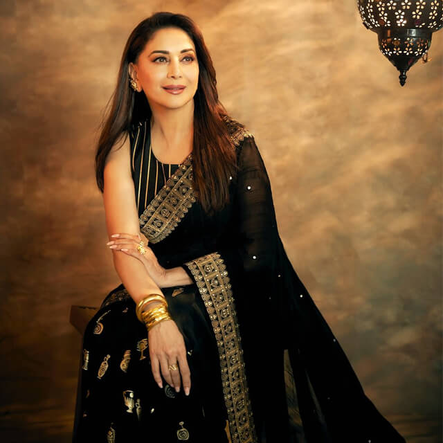 Madhuri Dixit looks charming in a Black & Gold Traditional Saree