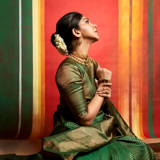 Madonna flaunts in an Emerald Green Brocade Saree