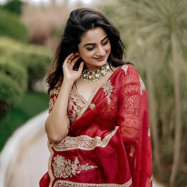 Namitha captivates in a Red Saree at her Friend's Wedding