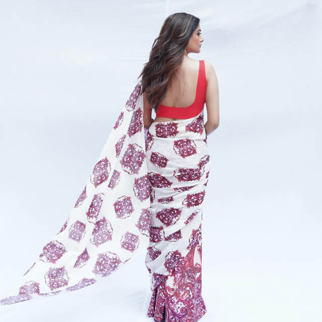 Priyamani stuns in a Red & White Saree