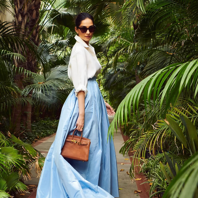 Sonam Styles in a White Shirt & Blue Skirt