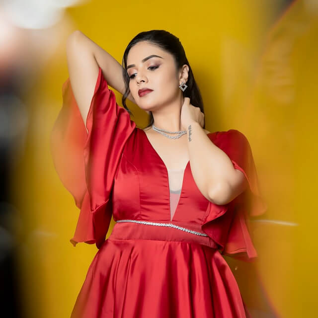 Sreemukhi poses wearing a Red Cocktail Dress by Shivani Priya