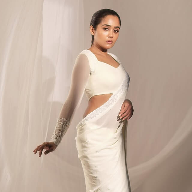 Ananya channels ethereal grace in a White Embroidered Saree Ananya channels ethereal grace in a White Embroidered Saree
