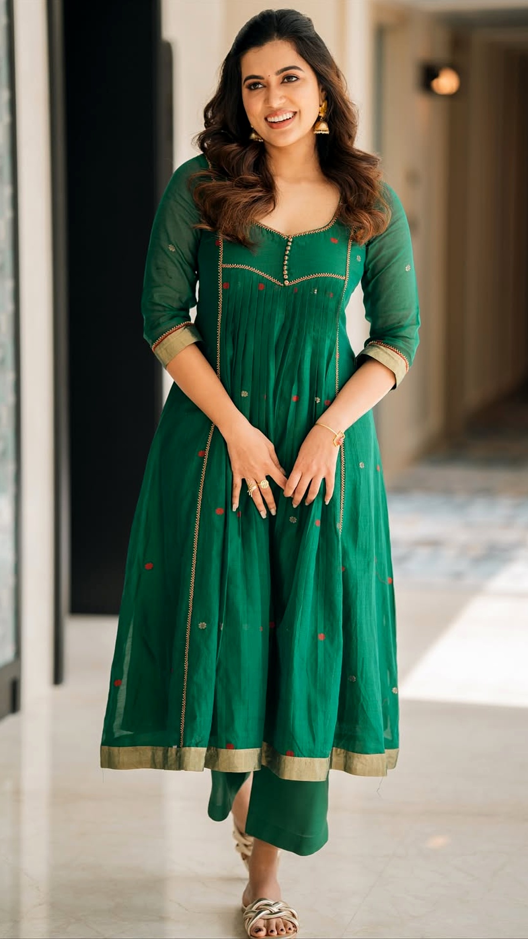 Anju Kurian's Recent Photoshoot - Simple yet stunning, this emerald green cotton Anarkali with delicate red motifs and gold borders highlights her effortless traditional beauty.