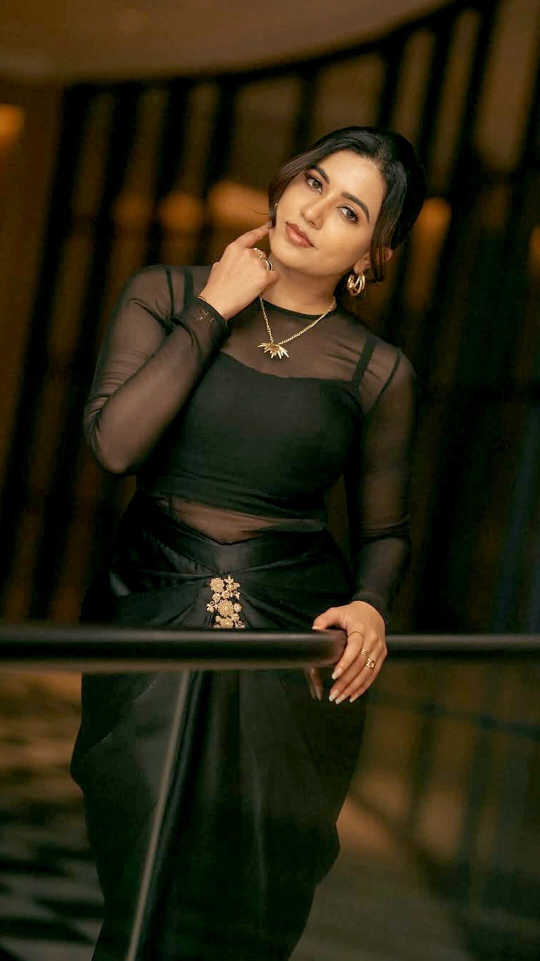 Anju Kurian's Recent Photoshoot - A sunburst pendant, gold hoops, layered rings, and slim bangles add a gentle gleam to Anju's ensemble without taking away its understated charm.