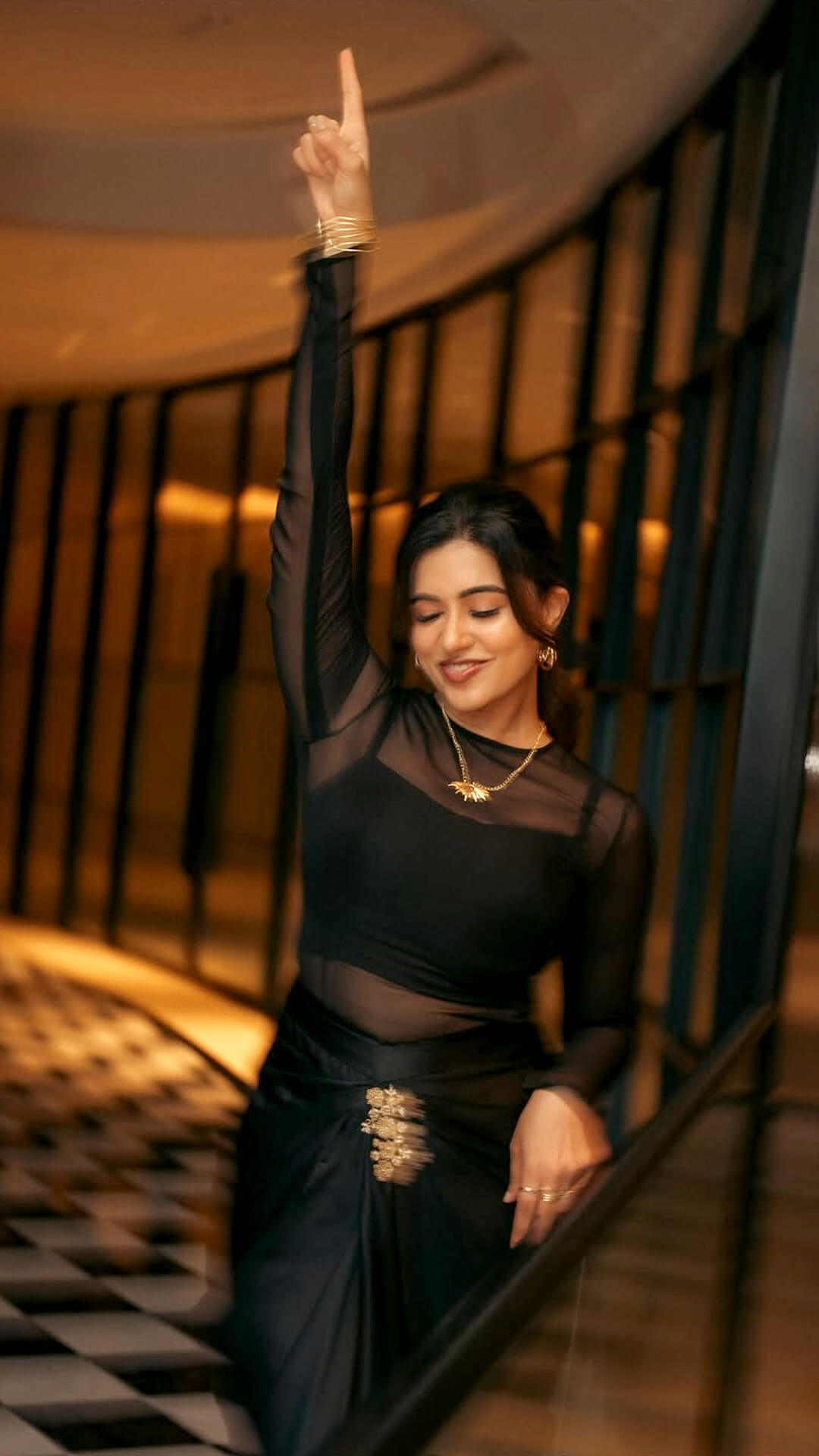 Anju Kurian's Recent Photoshoot - The sheer mesh overlay adds a hint of mystery, with full sleeves and a subtle inner layer giving Anju's look a refined, modern edge.