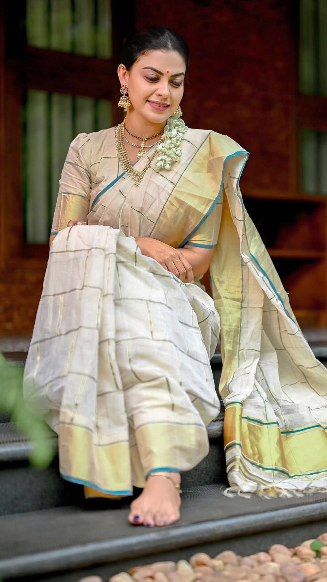 Anusree Nair's Recent Photoshoot - The neatly arranged front pleats introduce structure without distracting from the fabric. Their crisp fall gives the drape a composed appearance.