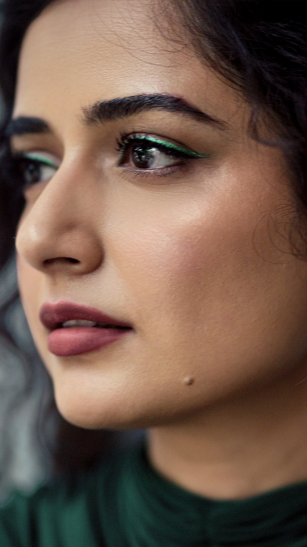 Ashika Ranganath's Recent Photoshoot - The portraits are shot by Abhilash Rangi, with styling assisted by Ajay Goud, framing the gown against weathered, textured walls.