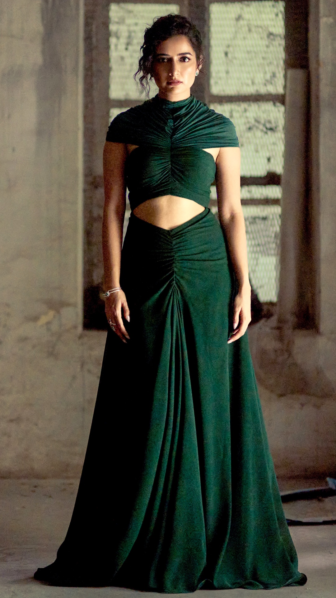Ashika Ranganath's Recent Photoshoot - Ashika Ranganath stepped out for the Sardar 2 trailer launch in Chennai wearing a deep emerald gown with a sculpted, ruched bodice and waist cutout.
