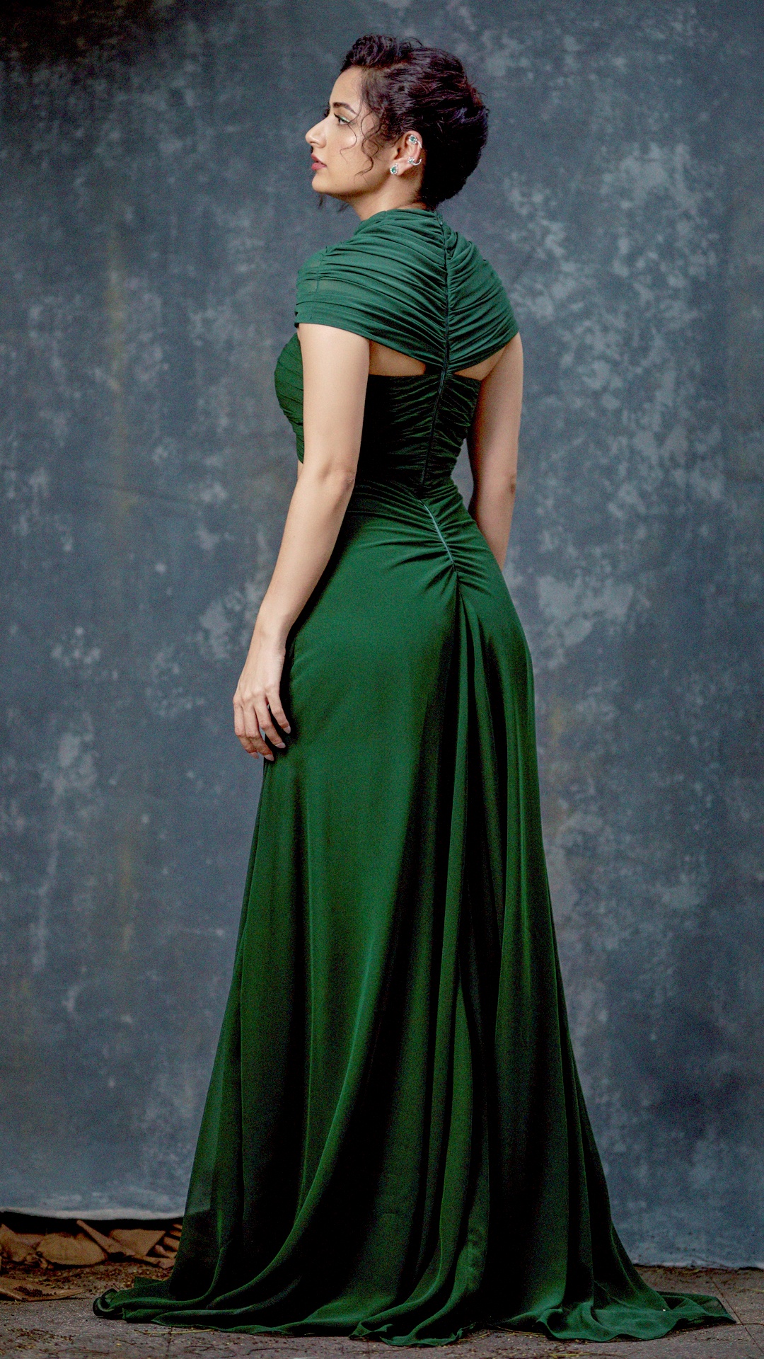 Ashika Ranganath's Recent Photoshoot - Turn around and the gown opens into a keyhole cutout beneath the collar, with the ruching mirrored down the spine.
