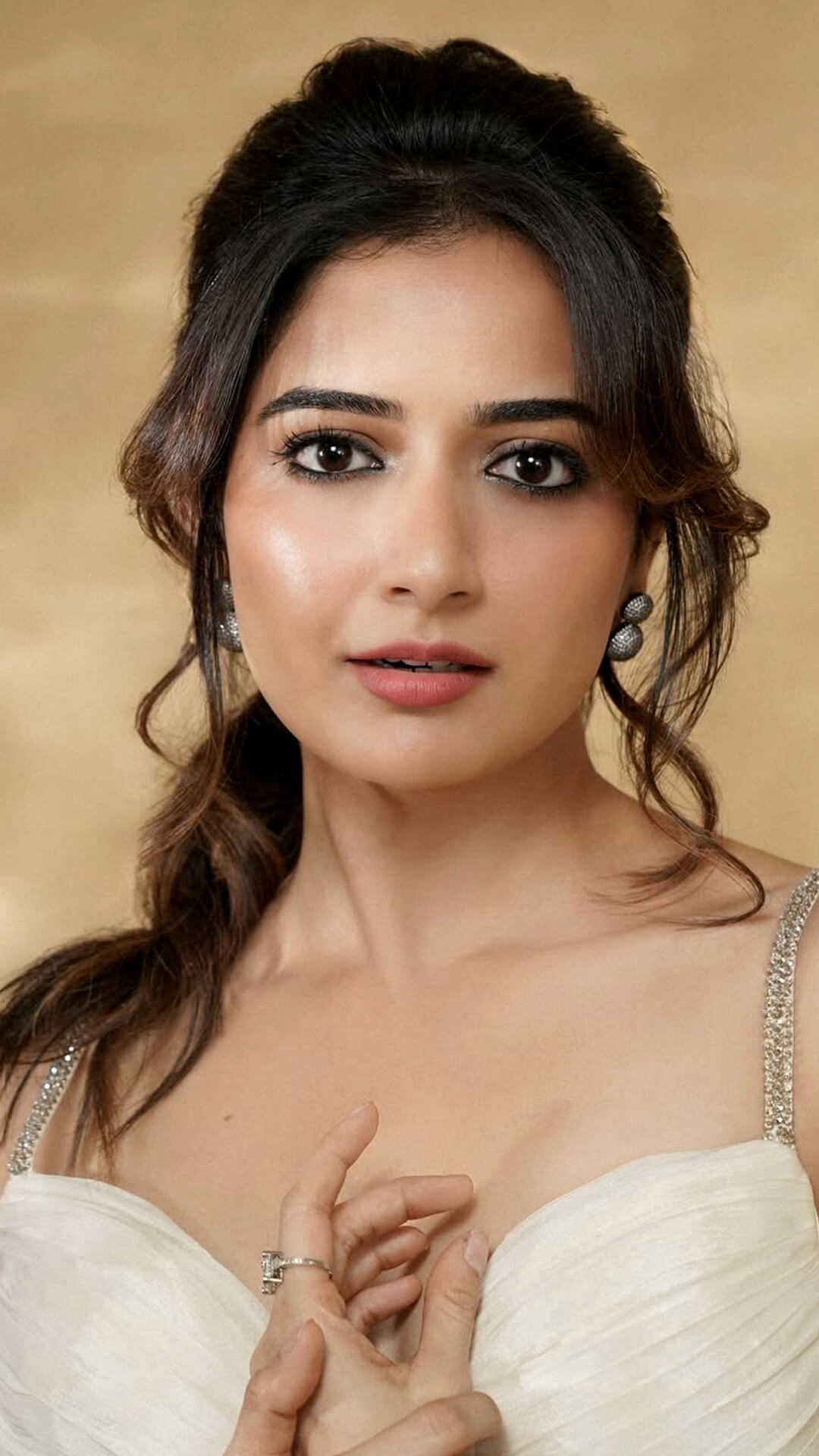 Ashika Ranganath's Recent Photoshoot - Abhirami Sivakumar created a luminous base with defined eyes and soft nude lips for a natural glow.