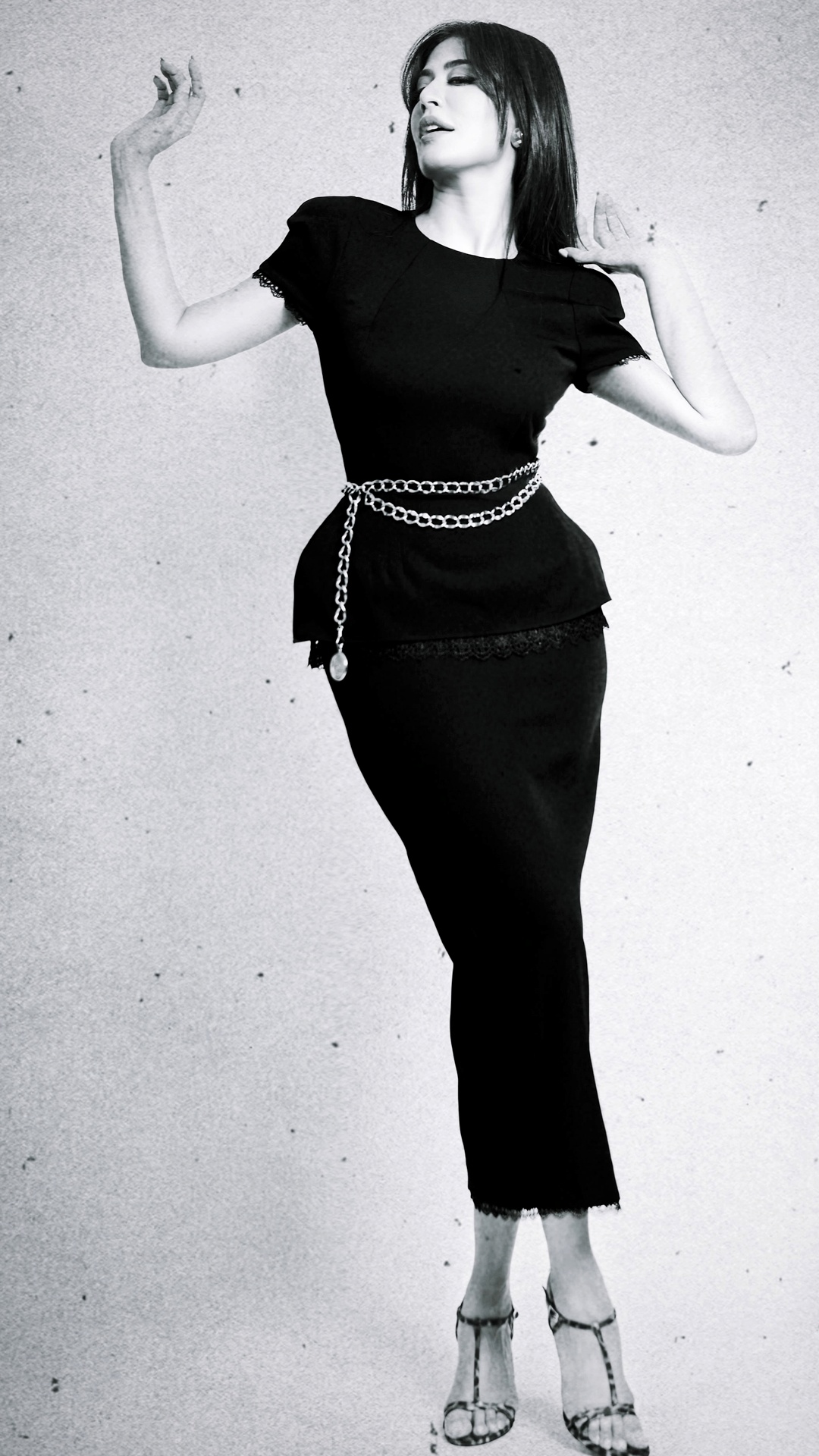 Chitrangada Singh's Recent Photoshoot - The Tutus Kurniati dress keeps the base black and streamlined, leaving its chain belt and lace trims to shape the visual rhythm.