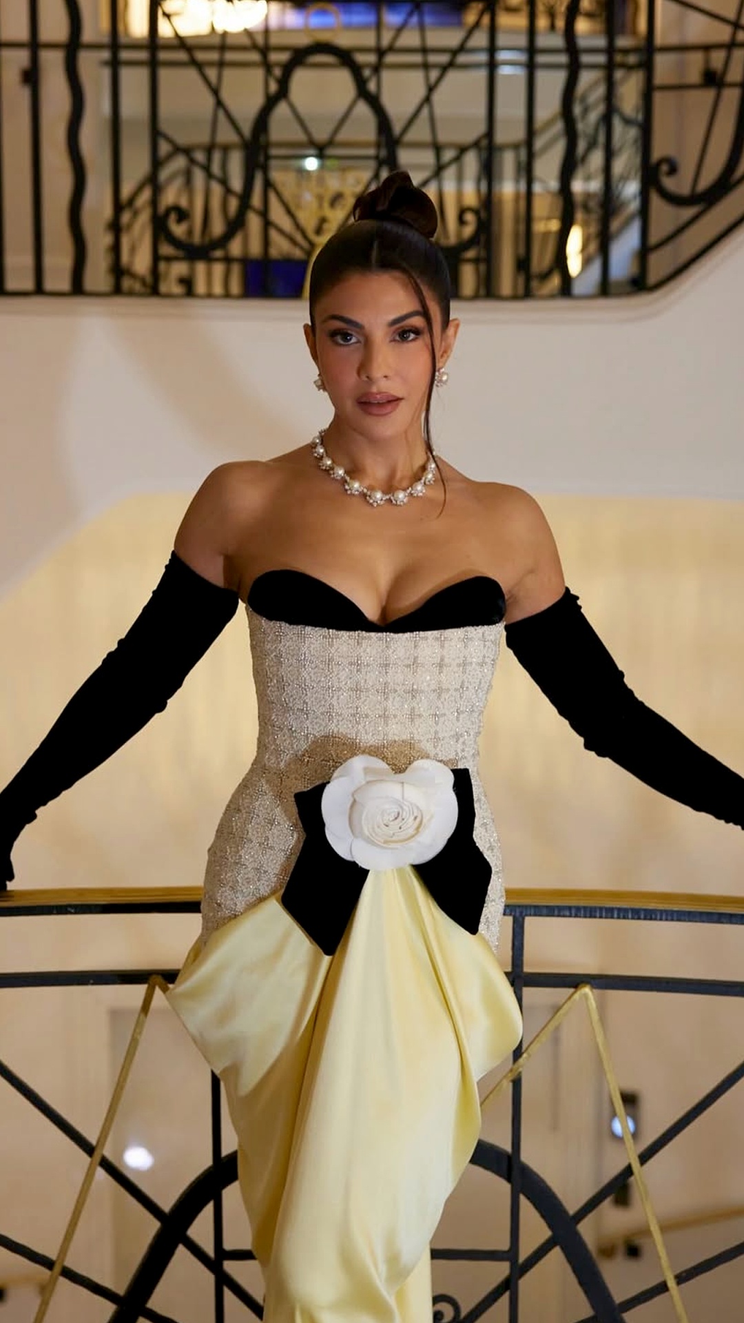 Jacqueline Fernandez's Recent Photoshoot - An oversized black bow sits right at the front waist, topped with a large white fabric flower appliqu&eacute; that looks just like a layered rose.