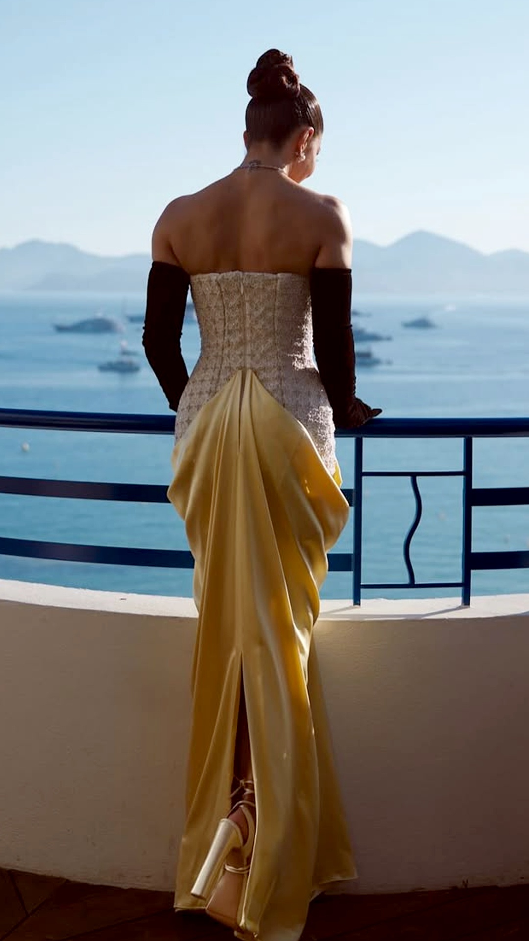 Jacqueline Fernandez's Recent Photoshoot - The strapless straight back leaves her shoulders bare, showing off the continuation of the corset, a center seam, a neat slit, and a slight train.