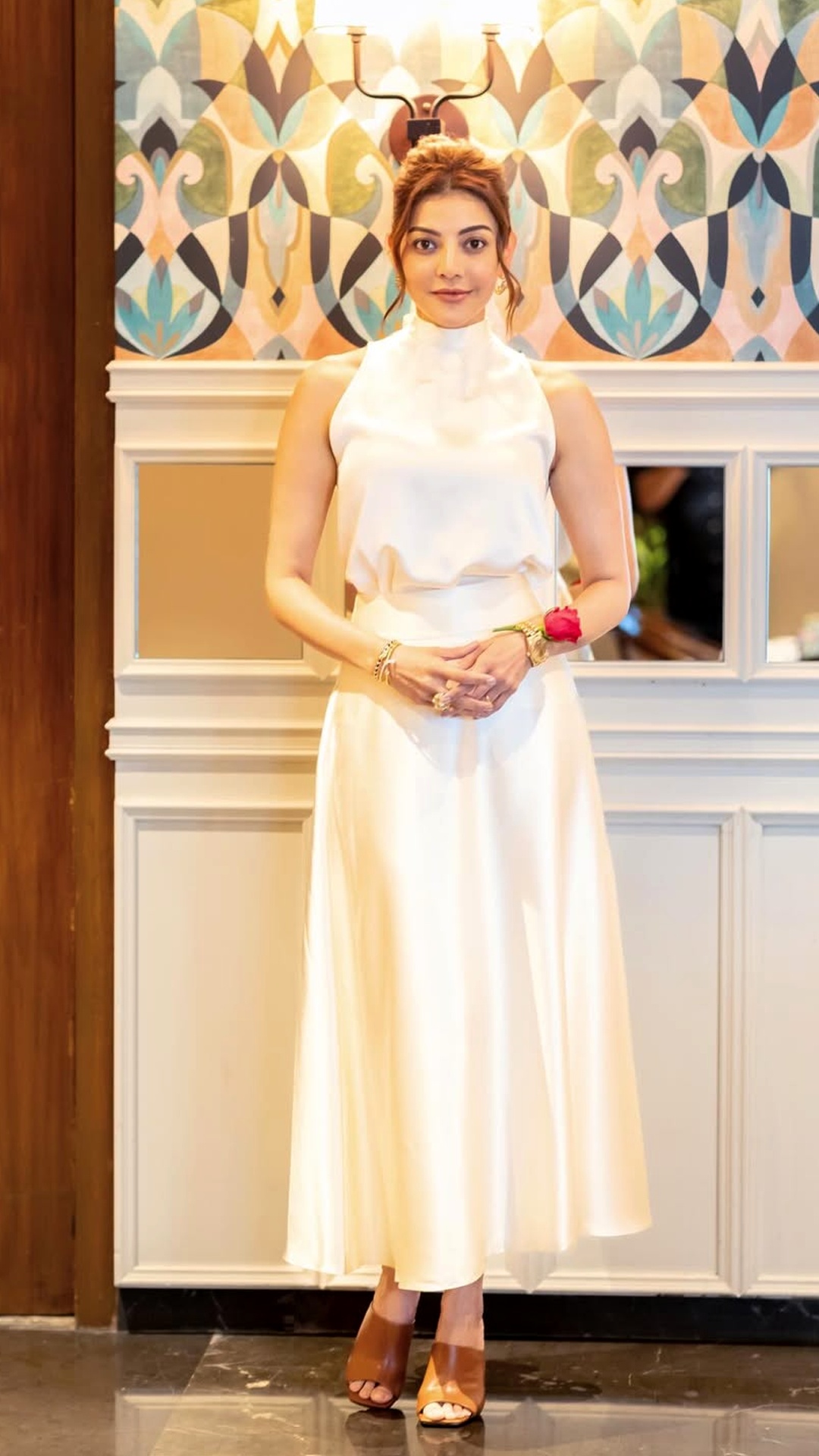 Kajal Aggarwal's Recent Photoshoot - The matching skirt flows gracefully to mid-calf. Its soft texture and clean flare from the waist create a feminine, polished silhouette.