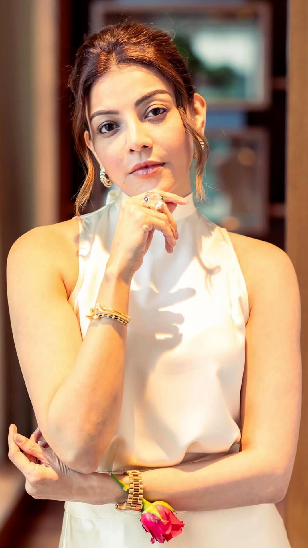 Kajal Aggarwal's Recent Photoshoot - She opts for a sleek low bun with gentle volume. Loose face-framing strands soften the look, adding movement and grace.