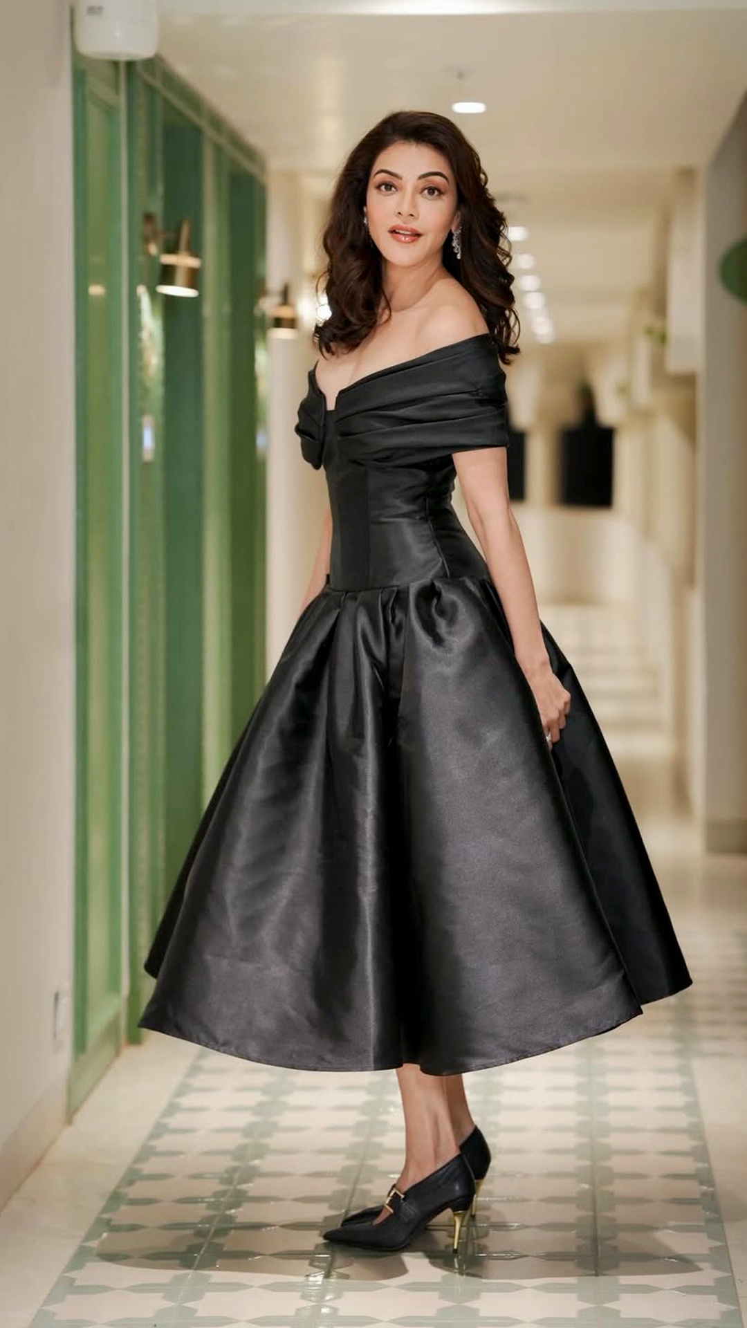 Kajal Aggarwal's Recent Photoshoot - Black closed-toe heels from Oroh, paired with a golden buckle heel, ground the look with subtle contrast.