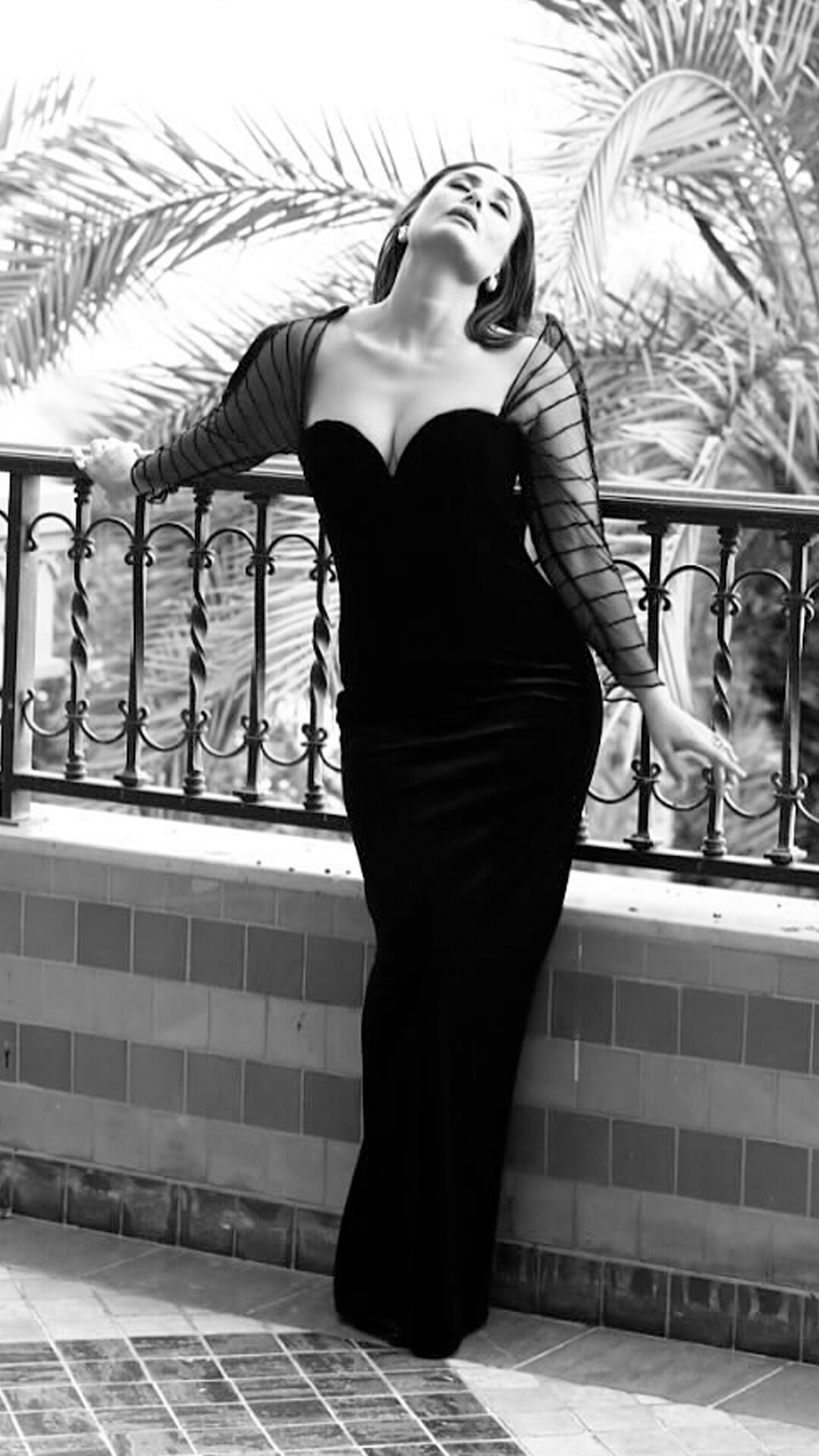 Kareena Kapoor's Recent Photoshoot - Kareena's Rahul Mishra gown in solid black redefines classic elegance with its monochrome palette and floor-length, body-hugging silhouette.