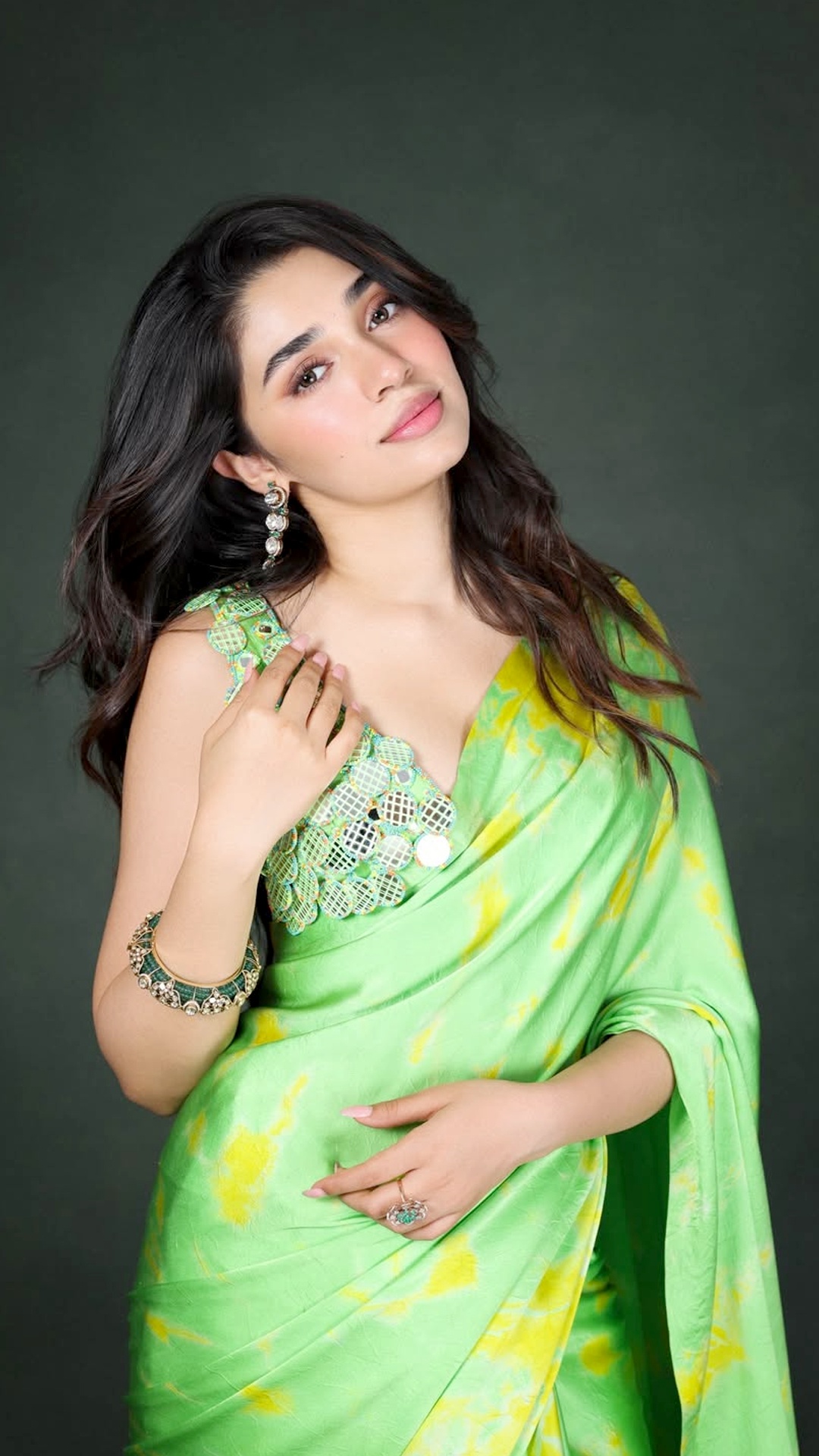 Krithi Shetty's Recent Photoshoot - Indriya Jewels add green accents through earrings, a bold bangle and ring, subtly matching the saree without overpowering it.