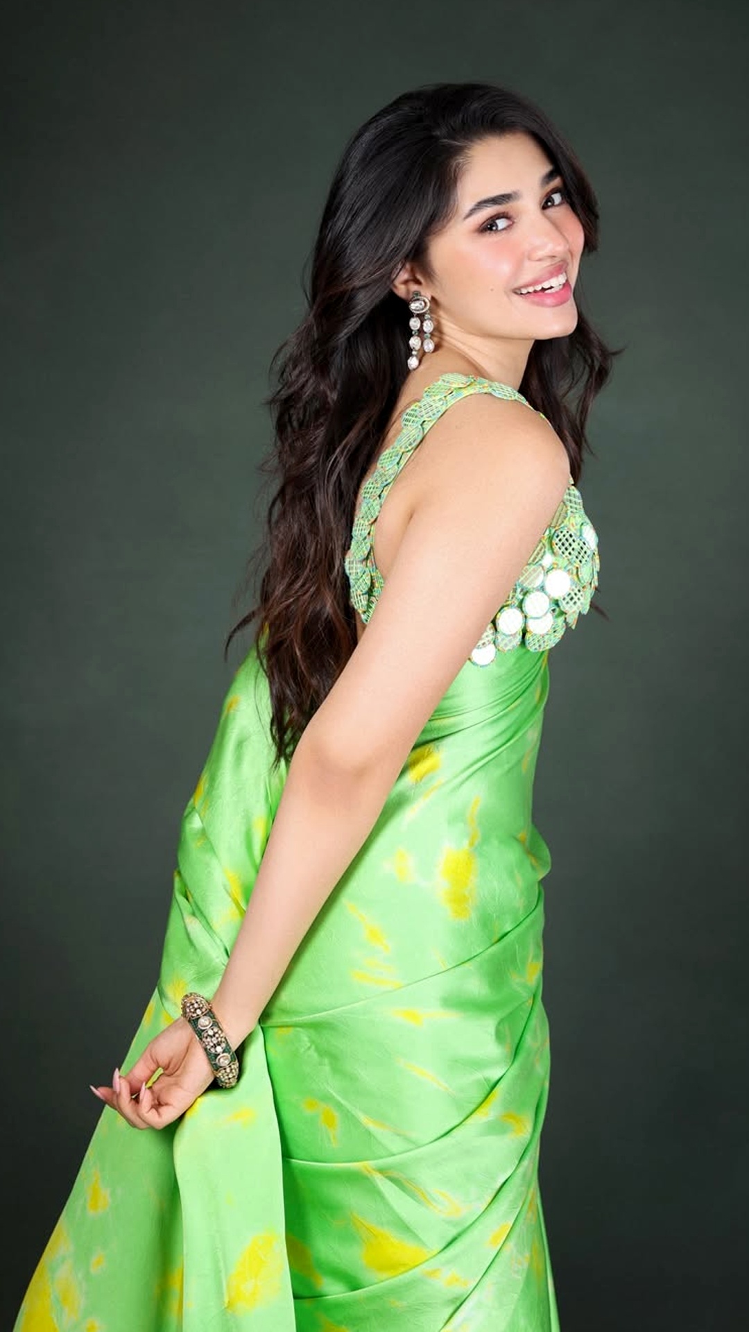Krithi Shetty's Recent Photoshoot - Shot by Pranav Maheshwari, the dark green backdrop and soft lighting create a clean, elegant mood that highlights every detail.