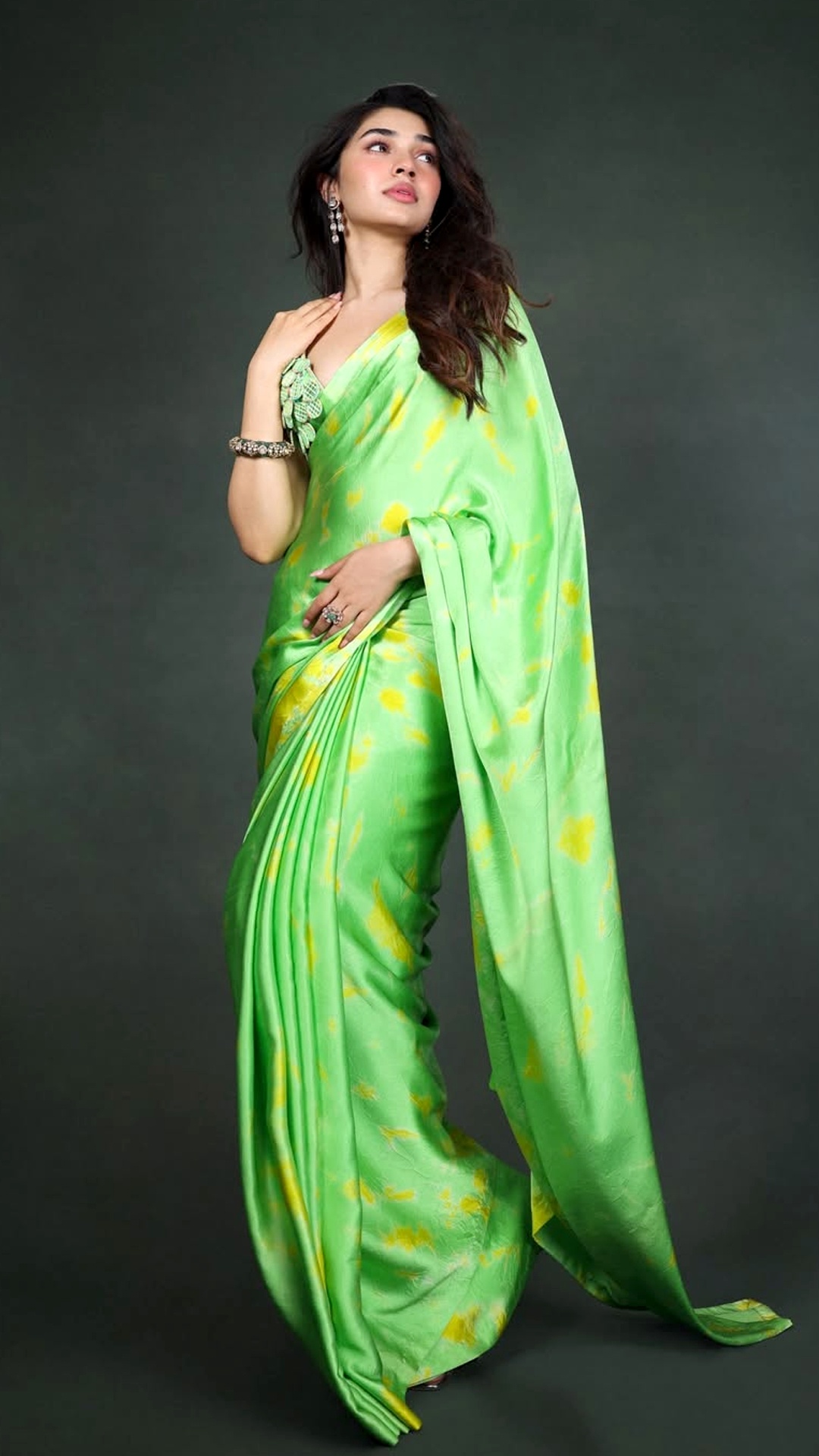 Krithi Shetty's Recent Photoshoot - This Akanksha Gajria saree blends lime green and yellow in hand-dyed satin silk, giving a fluid drape that feels light, vibrant and easy to carry.