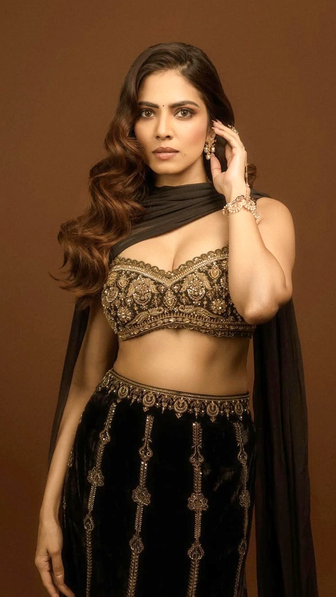 Malavika Mohanan's Recent Photoshoot - A sheer black dupatta is draped effortlessly over one shoulder for a soft, fluid finish.