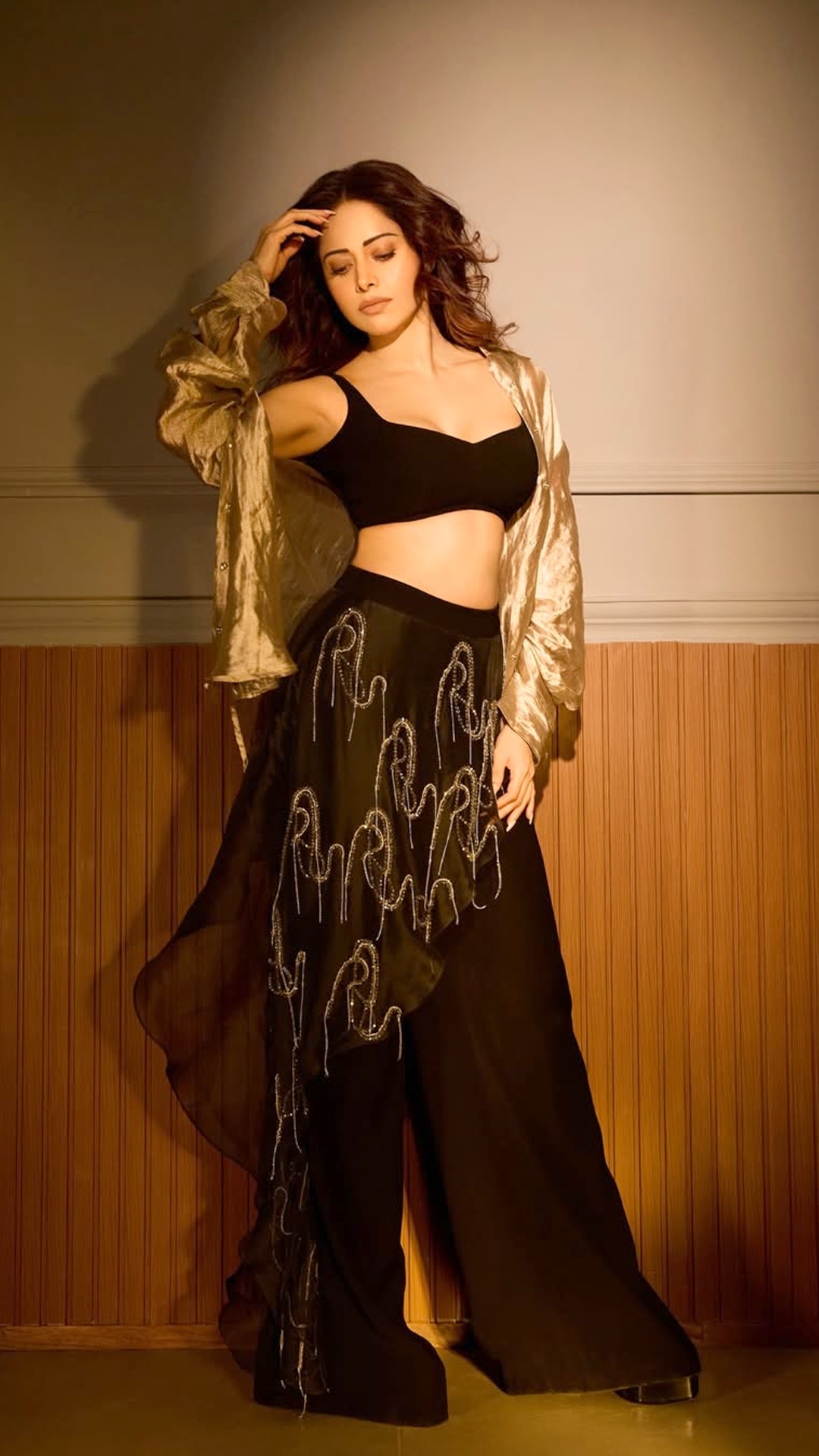 Nushrratt Bharuccha's Recent Photoshoot - Comfort meets style with these high-waisted bottoms. They feature a cool asymmetrical sheer panel that flows beautifully as she moves.