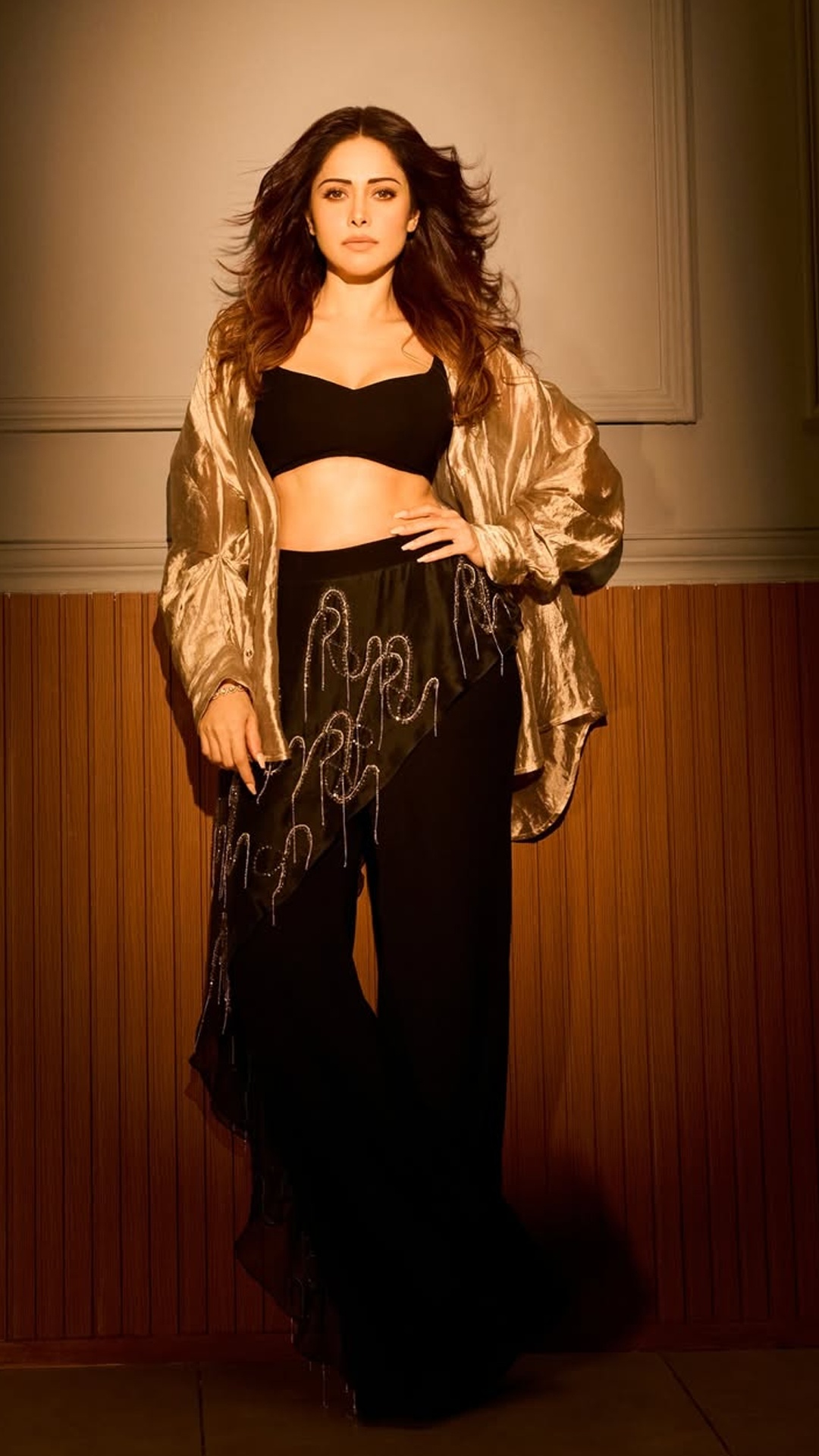 Nushrratt Bharuccha's Recent Photoshoot - Captured by Shivam Gupta, the warm golden tones and sharp shadows create a moody, high-fashion atmosphere for Nushrratt's shoot.