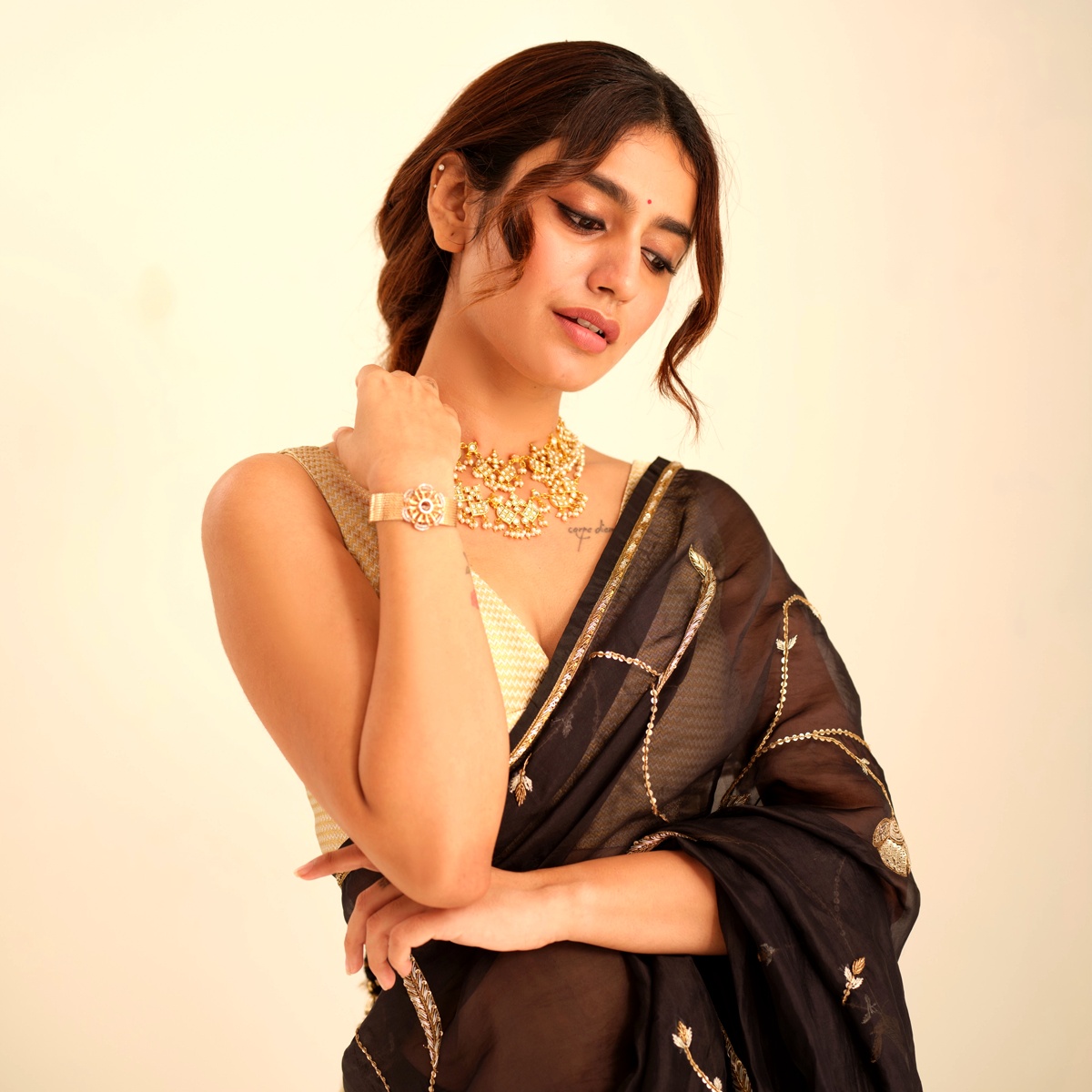 The Bold Blouse Hiding Under Priya Varrier's Black Saree