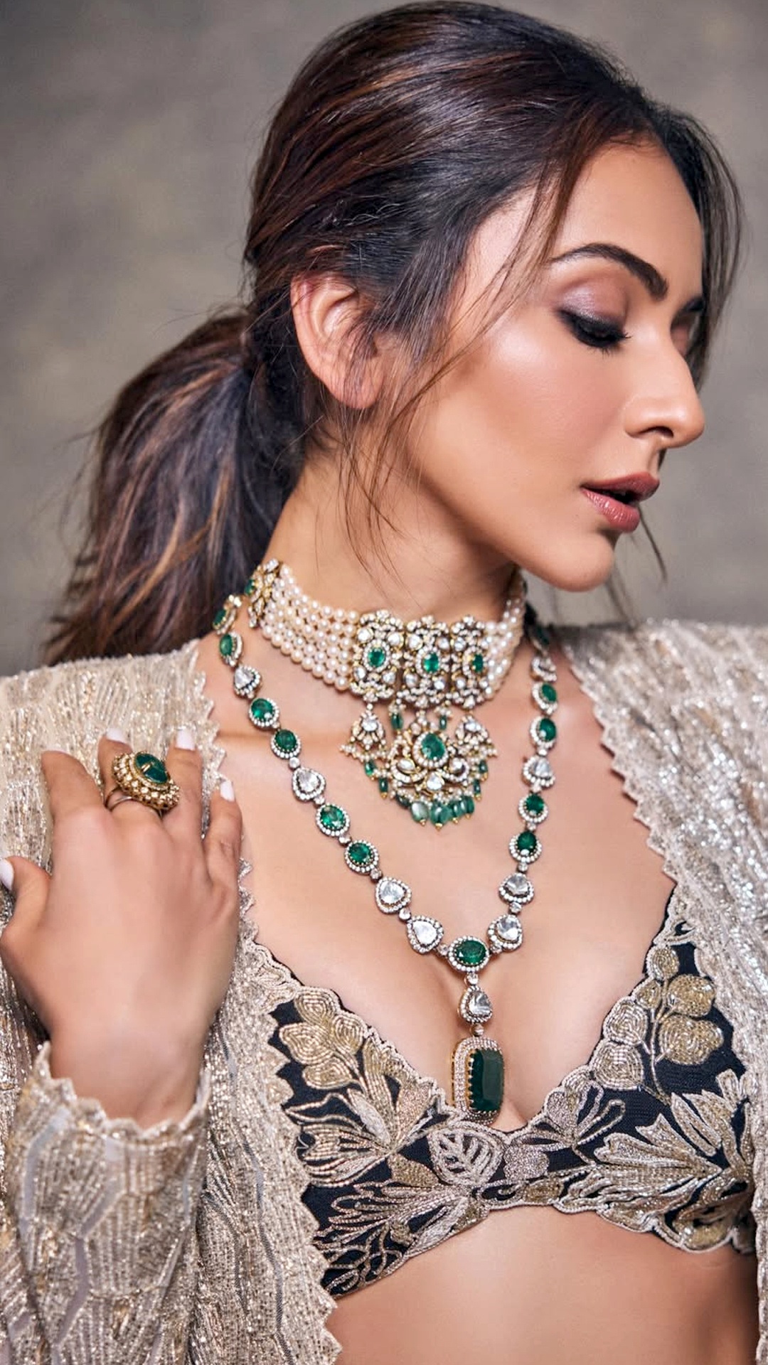 Rakul Preet Singh's Recent Photoshoot - Aliya Shaik styled a low ponytail with soft crown volume and loose face-framing strands for grace.