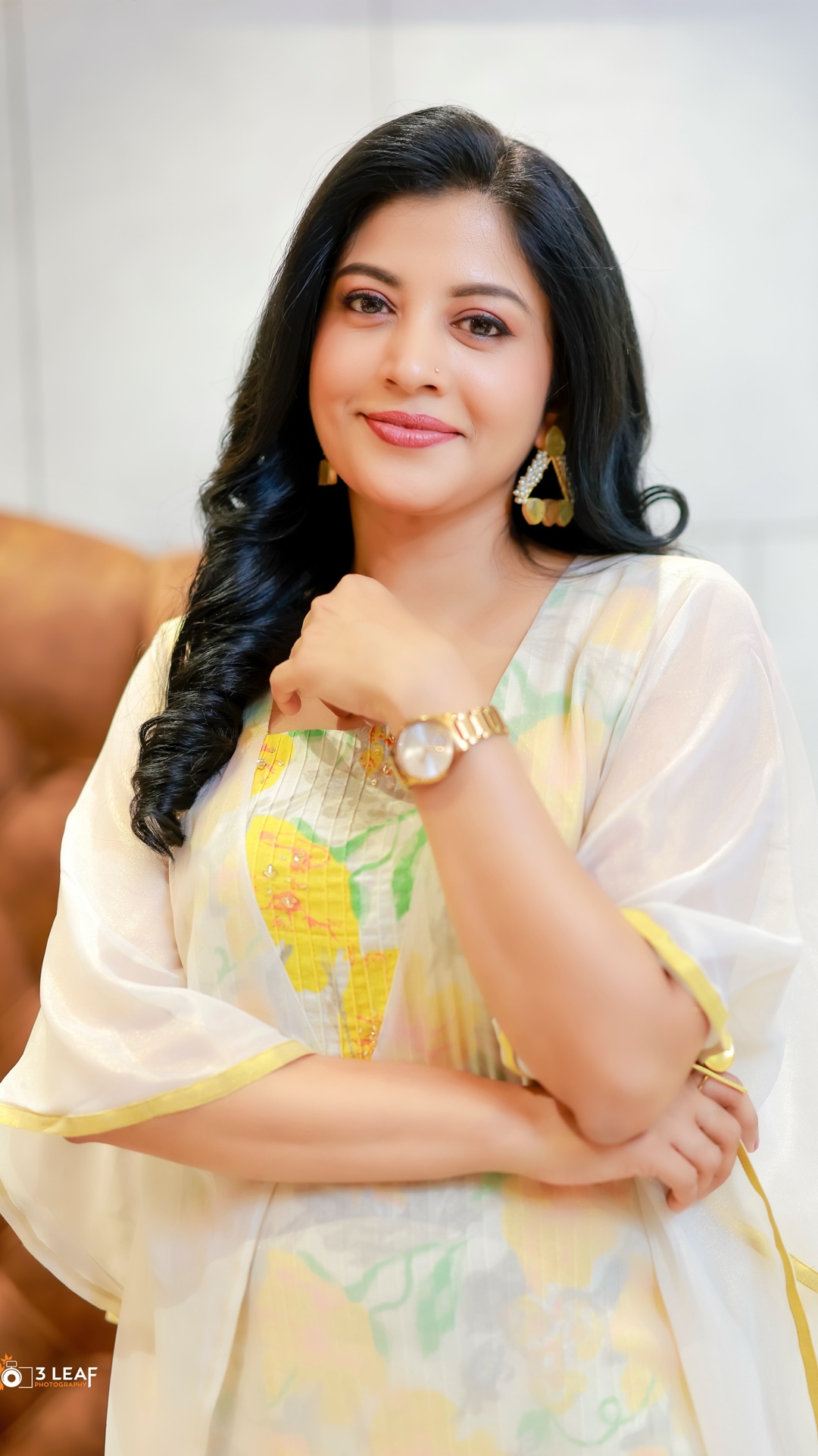 Shivada's Recent Photoshoot - Geometric gold-toned earrings, a wristwatch and rings complement the look without competing with the floral detailing or airy silhouette.