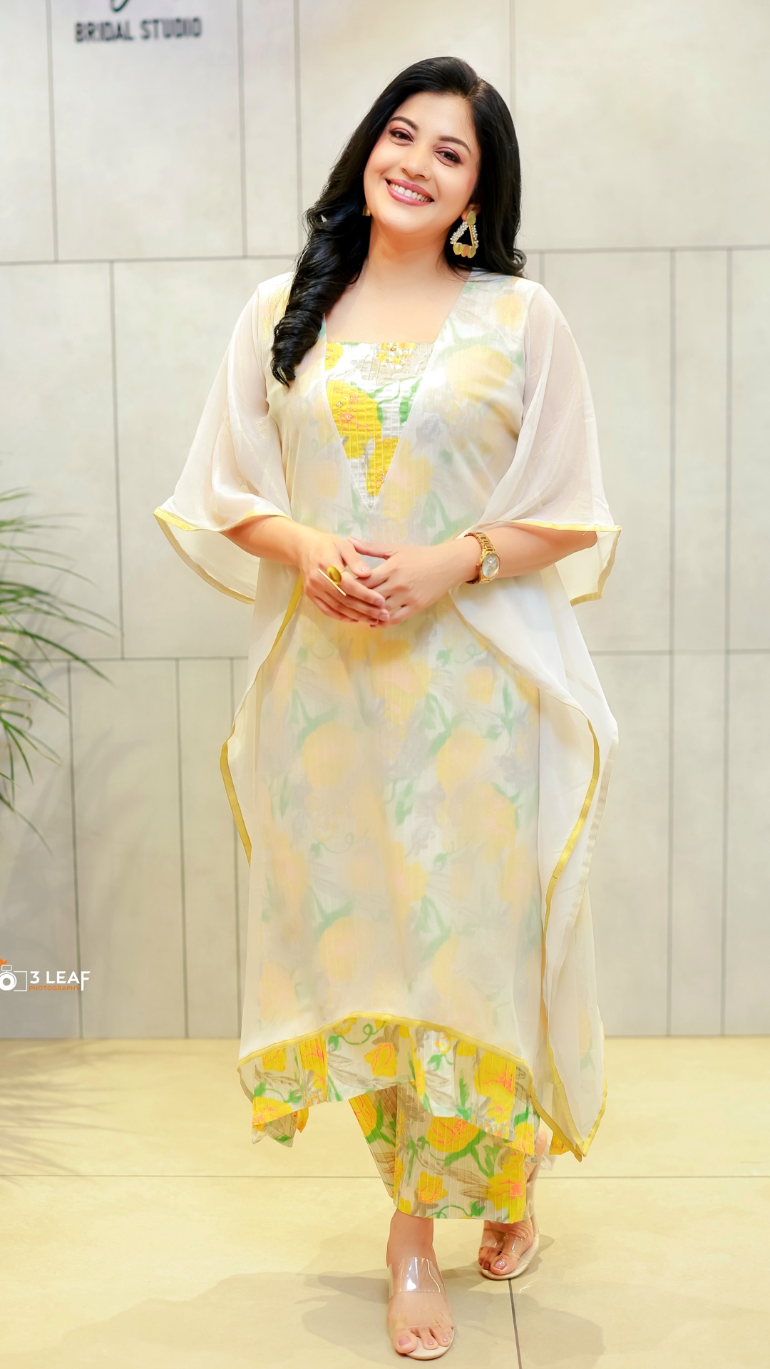 Shivada's Recent Photoshoot - Soft ivory, pale green and gentle yellow create a calm palette. The brighter floral accents draw the eye without disturbing the outfit's quiet balance.