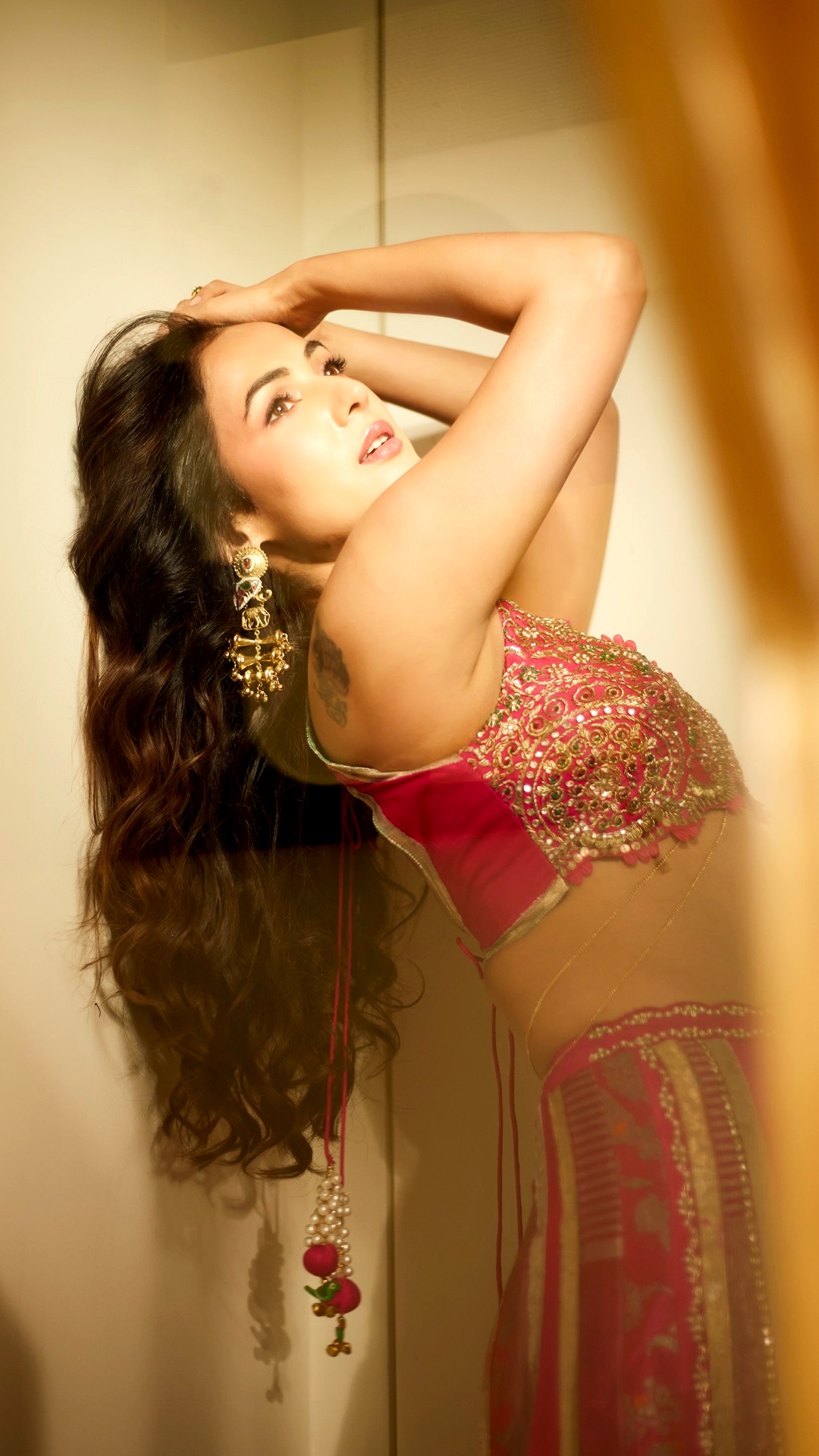 Sonal Chauhan's Recent Photoshoot - Through the shoot, Sonal wears layered gold drop earrings from Curio Cottage, from a pearl-and-bell jhumka to a tiered medallion design.
