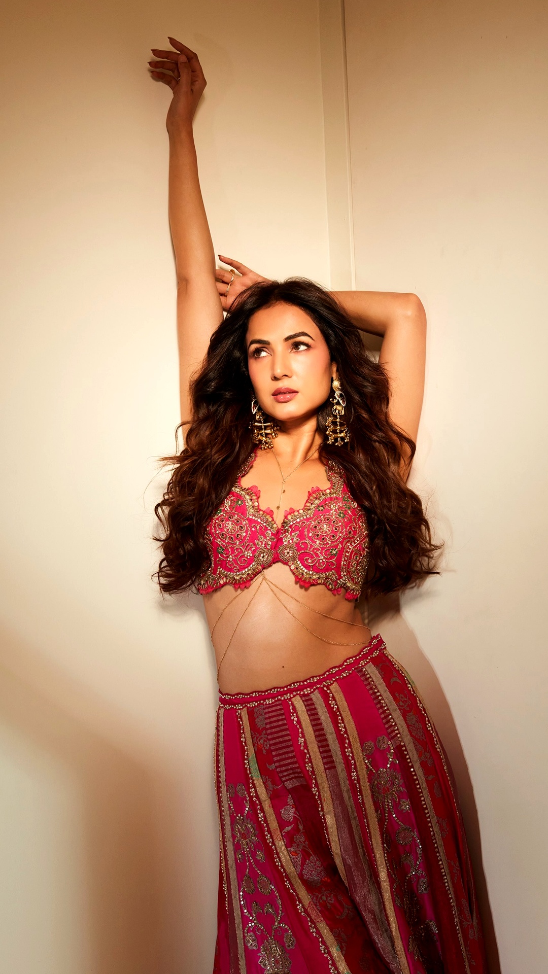 Sonal Chauhan's Recent Photoshoot - A slim gold chain traces the exposed waist as a pearl-and-pom-pom tassel drops from the hip, styled by Devki Bhatt, Payal Shingavi and Dhruvi Shetty.