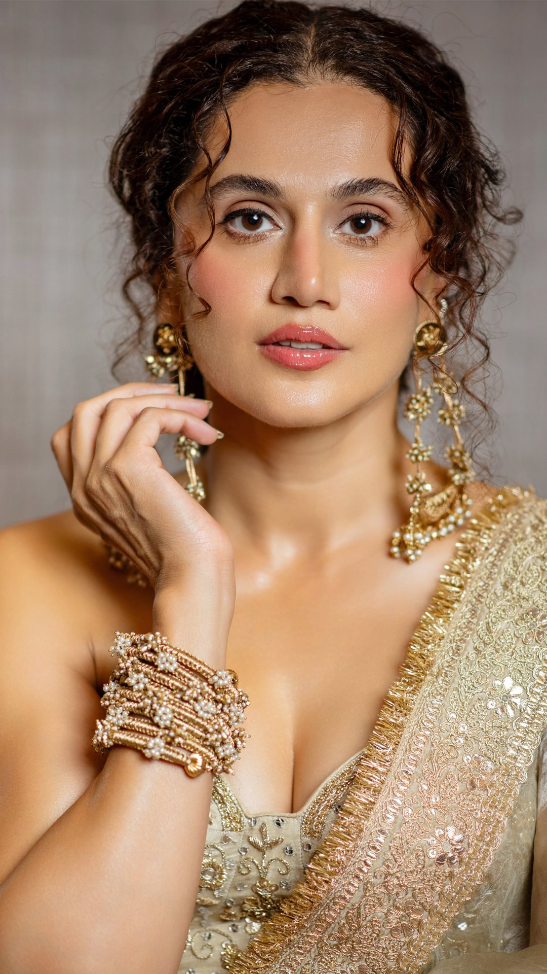 Taapsee Pannu's Recent Photoshoot - Statement Amama Chand shikara earrings (Rs. 5,500/-) and the stacked Basra wristwrap bracelet (Rs. 3,600/-) frame the strapless silhouette effortlessly.
